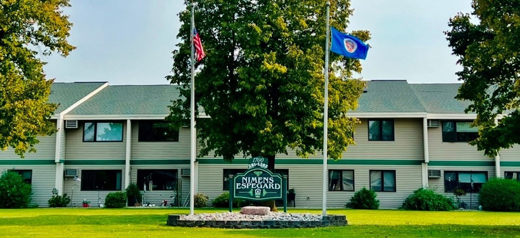 A building with a sign that says "Northern Essex" in front of it.