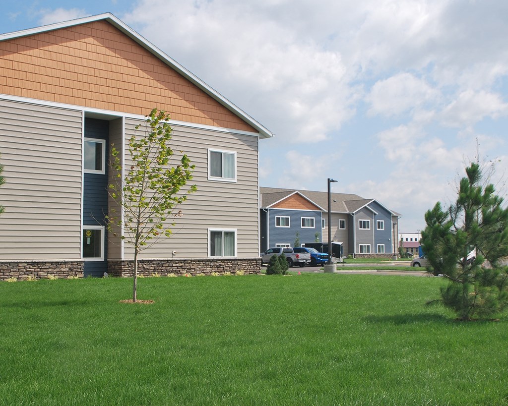 a green lawn in front of a house