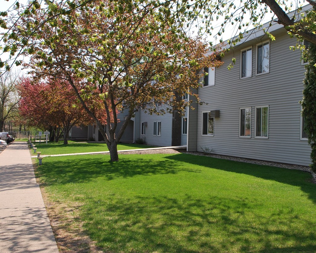 a yard in front of a white house