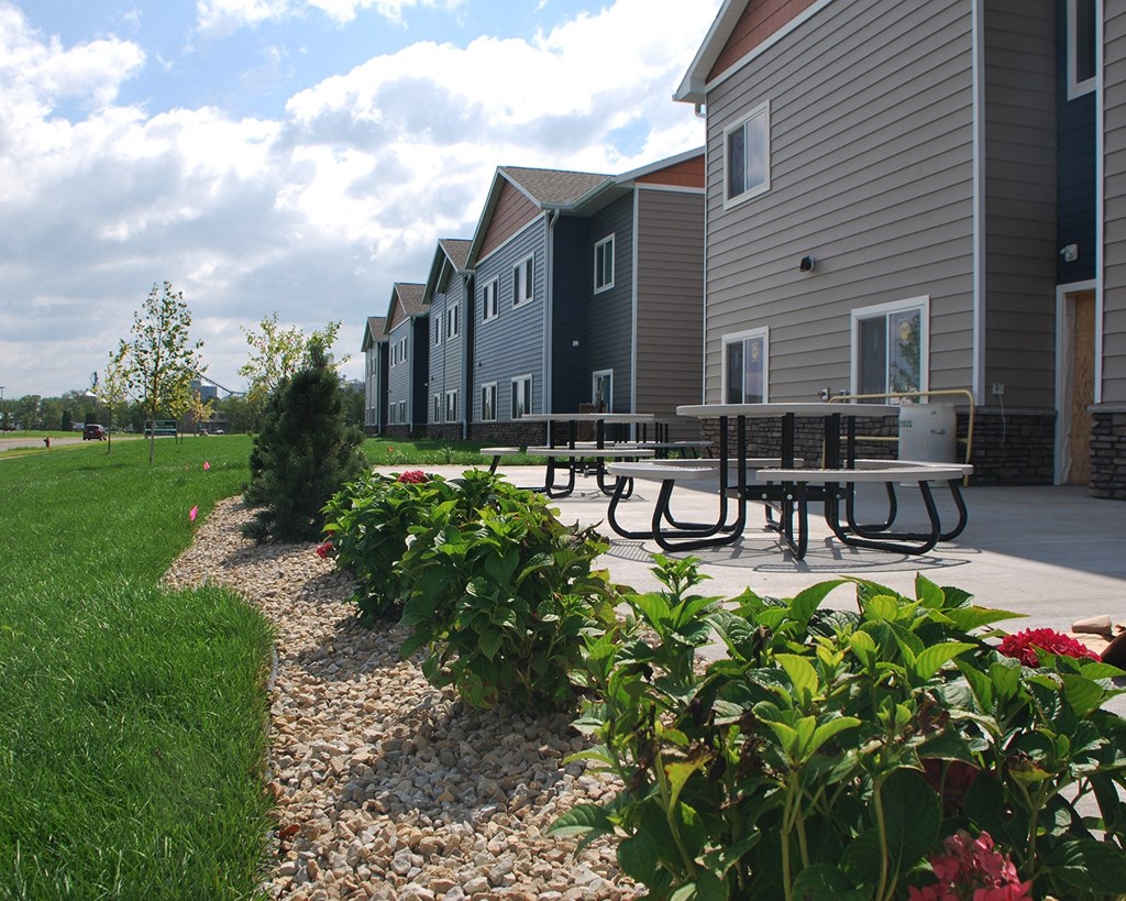 a picnic table in front of a building