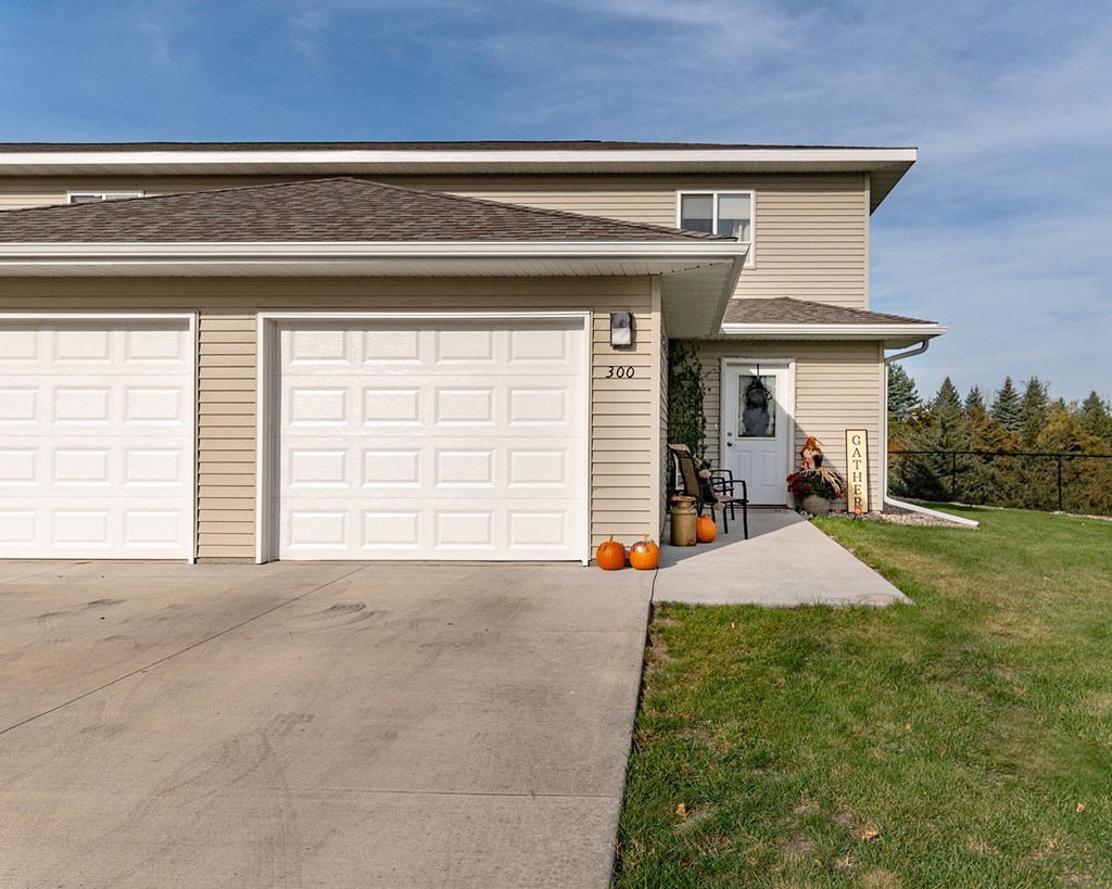 a house with a white garage door in front of it