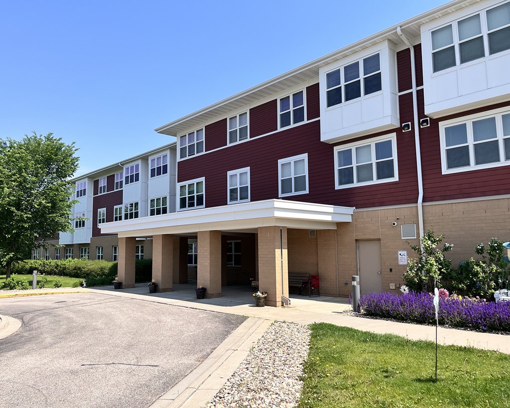 A red and white building with a clear blue sky in the background.