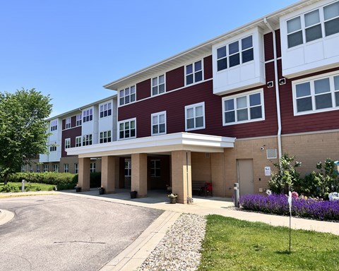 A red and white building with a clear blue sky in the background.