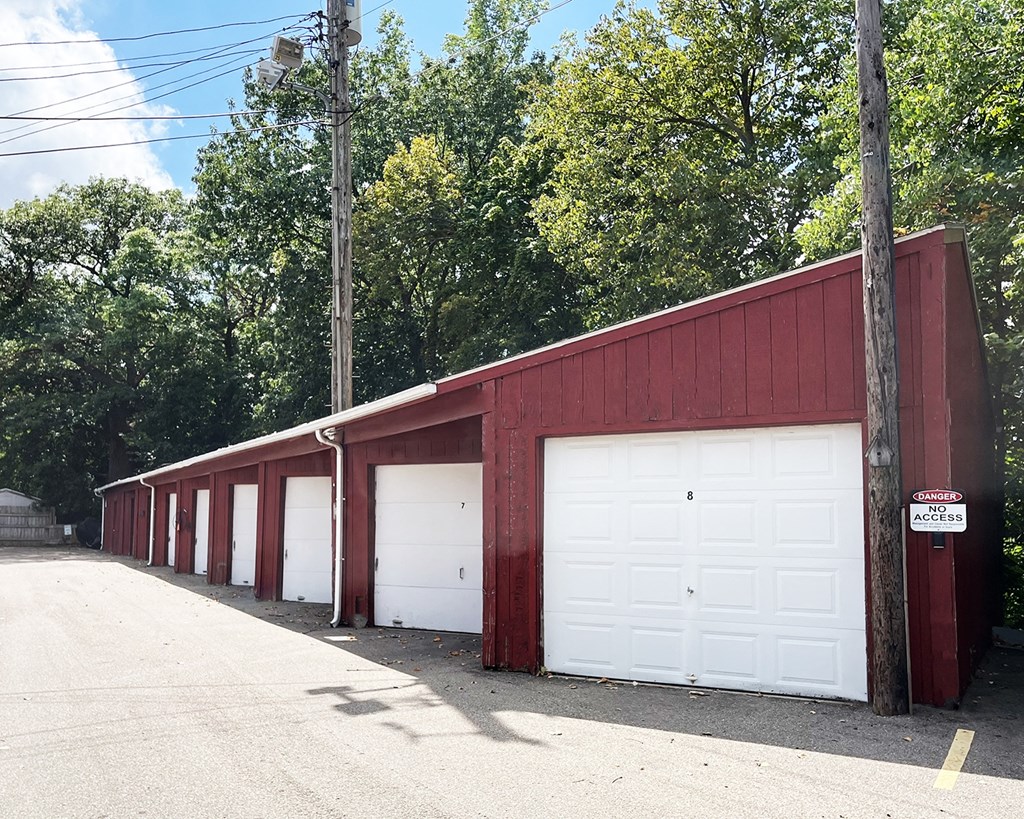 a red building with white garage doors