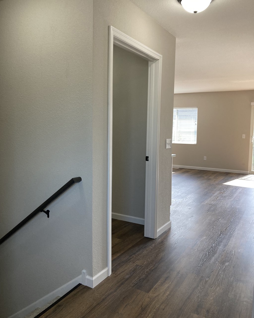 a photo of the hallway and living room of a 560 square foot, 1 bedroom apartment at