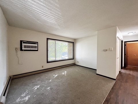 A room with a window and a door.