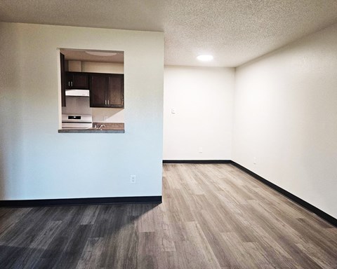 A kitchen area with a stove and cabinets.