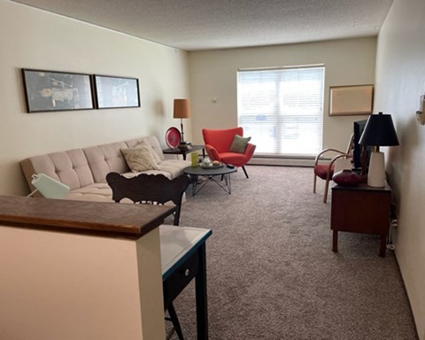 a living room with a couch and a table