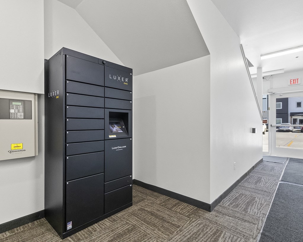 a black filing cabinet in the corner of a room