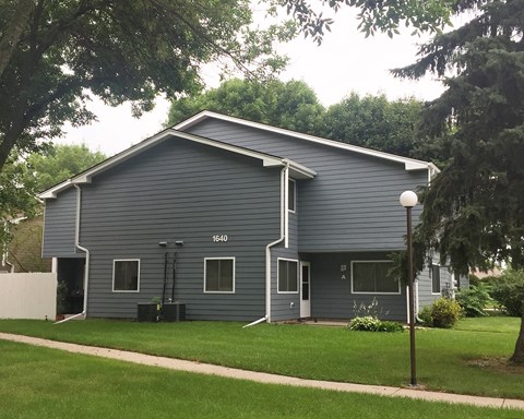 A grey house with the number 1840 on it.