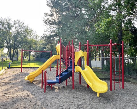 a playground with slides at a park