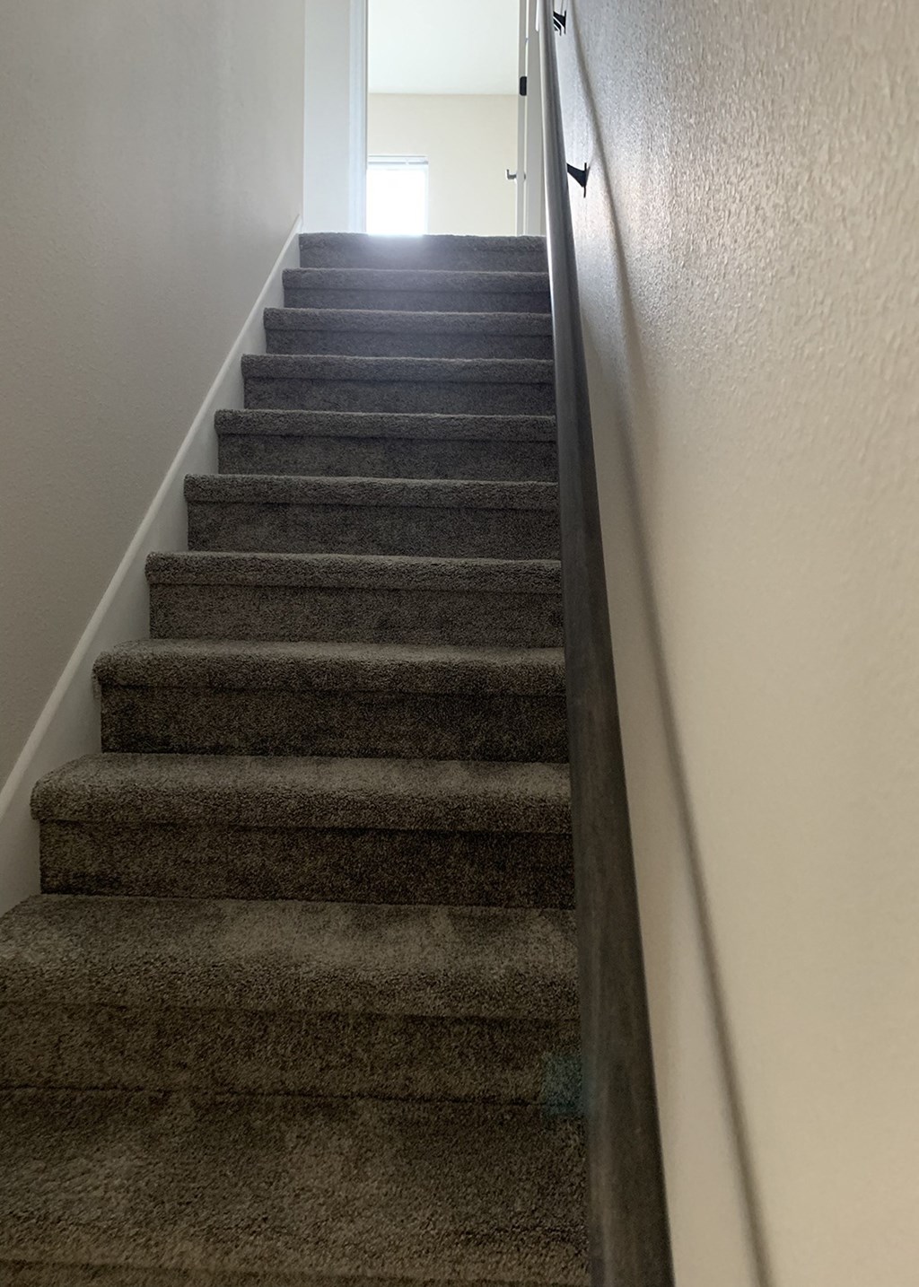 a view from the bottom of the stairs looking up
