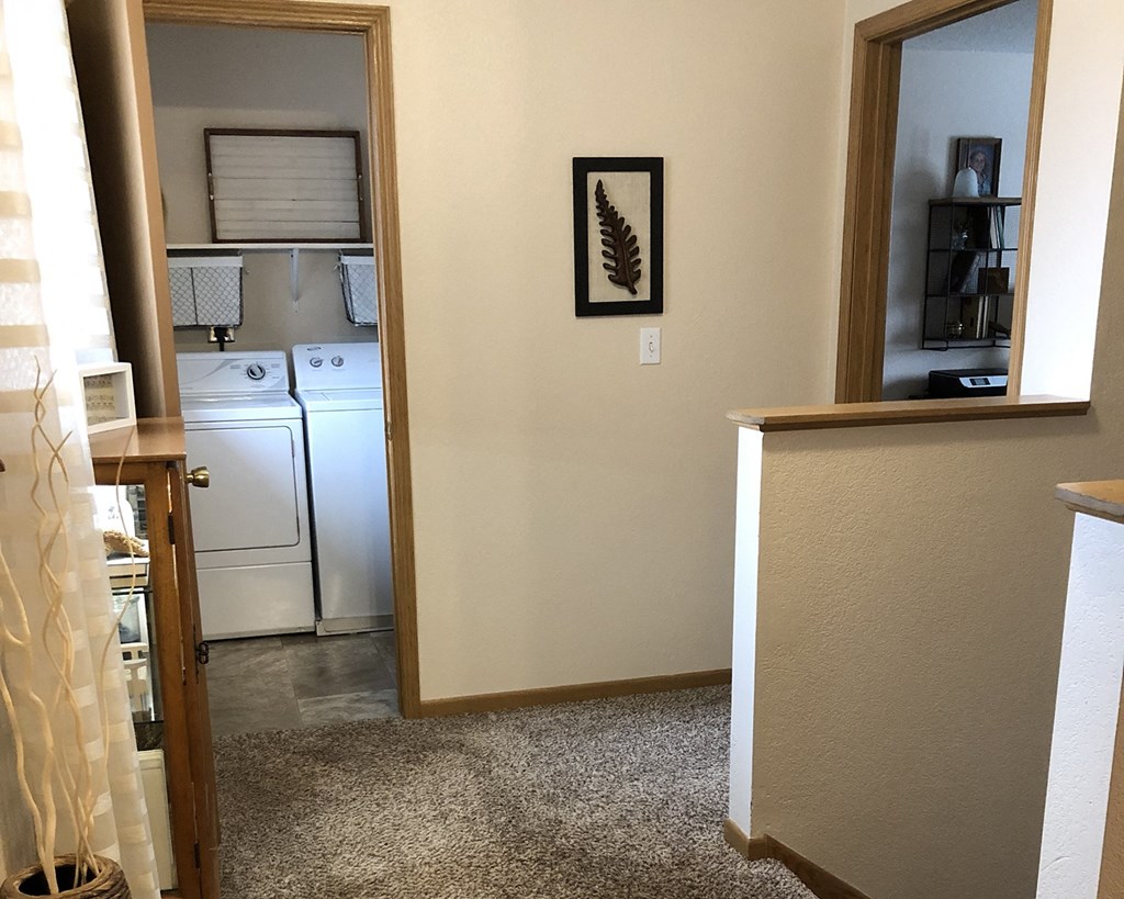 a laundry room with a washer and dryer