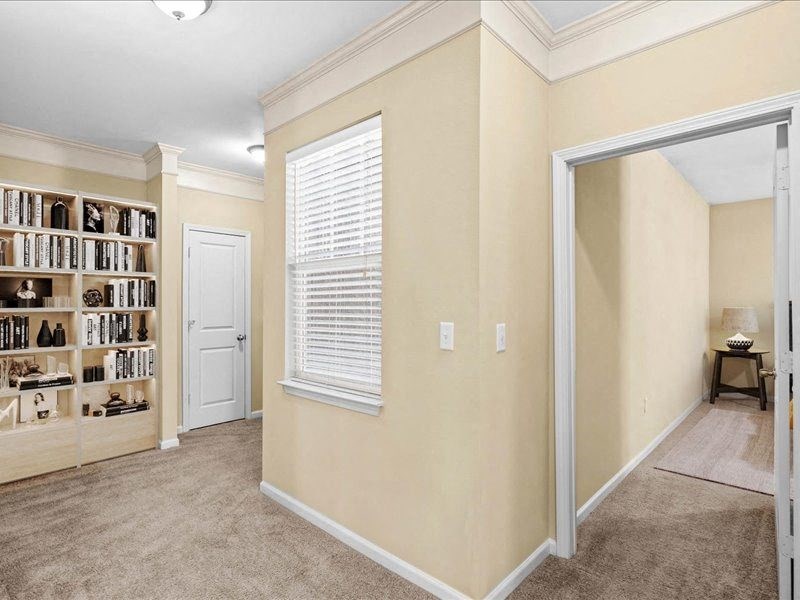 a room with a mirror and a closet and a window