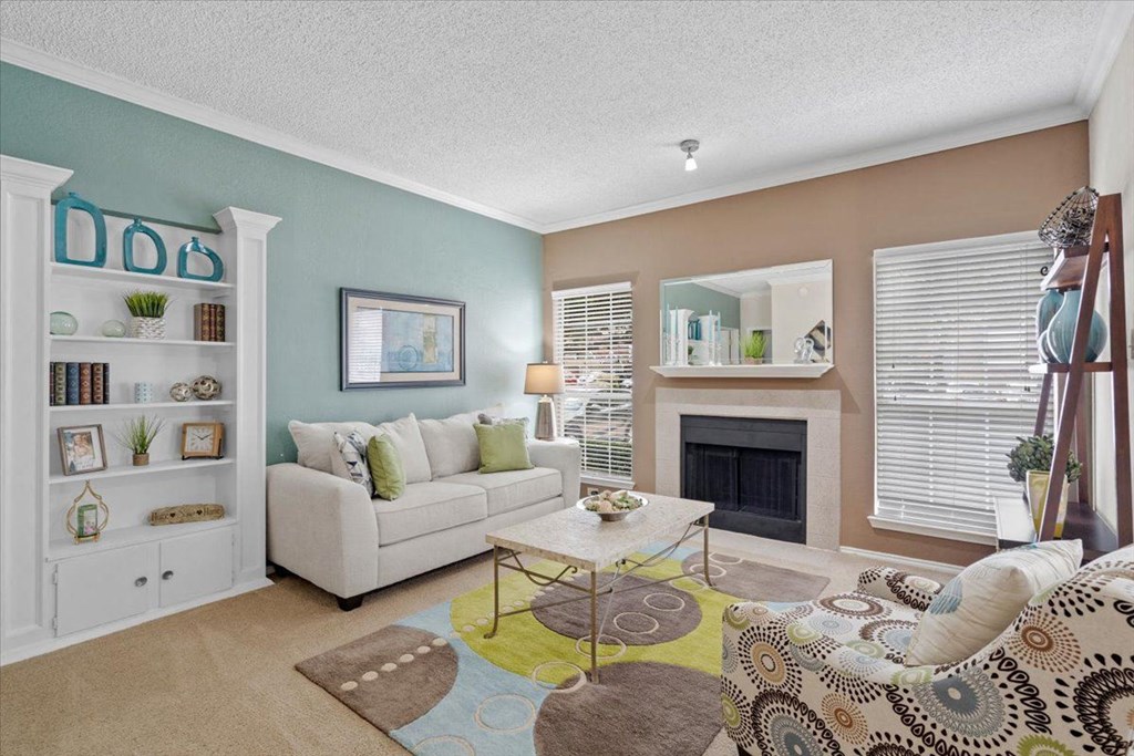 a living room with two couches and a coffee table at Creekview Apartment Homes, Dallas, TX