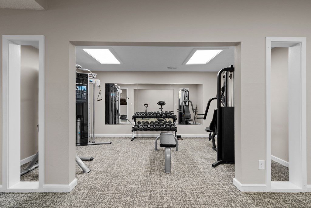 the gym at the enclave at woodbridge apartments in sugar land, tx at Millcreek Woods Apartments, Olathe