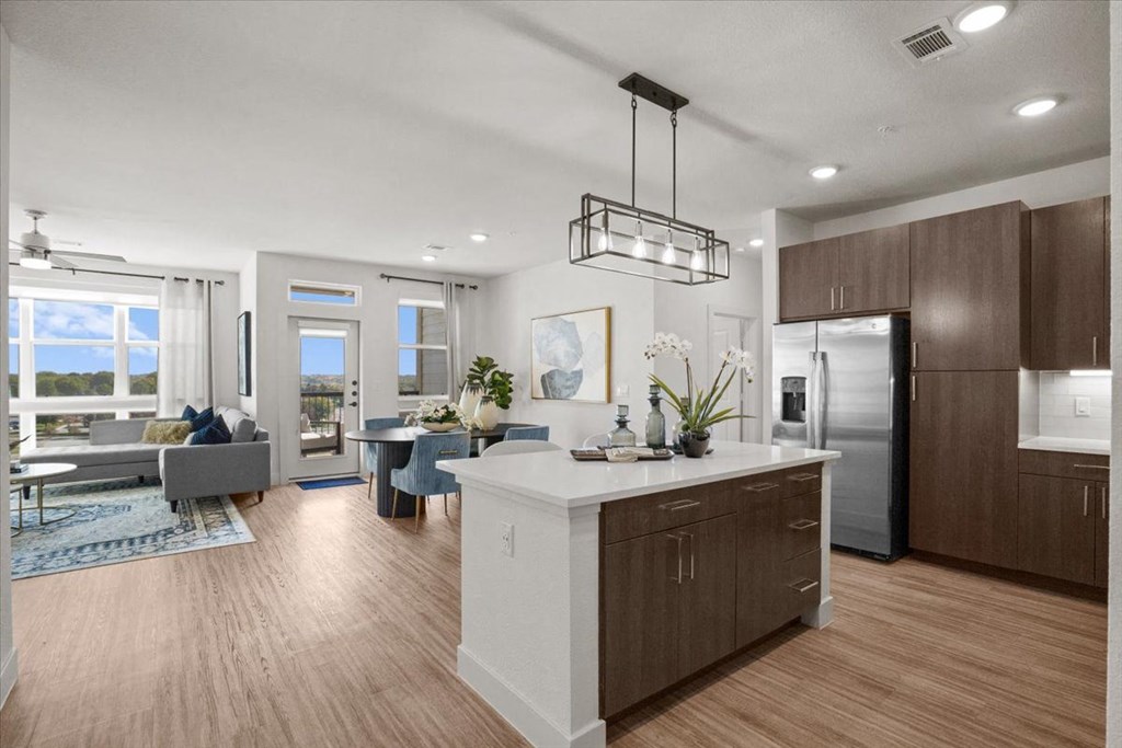 an open floor plan with a kitchen and living room