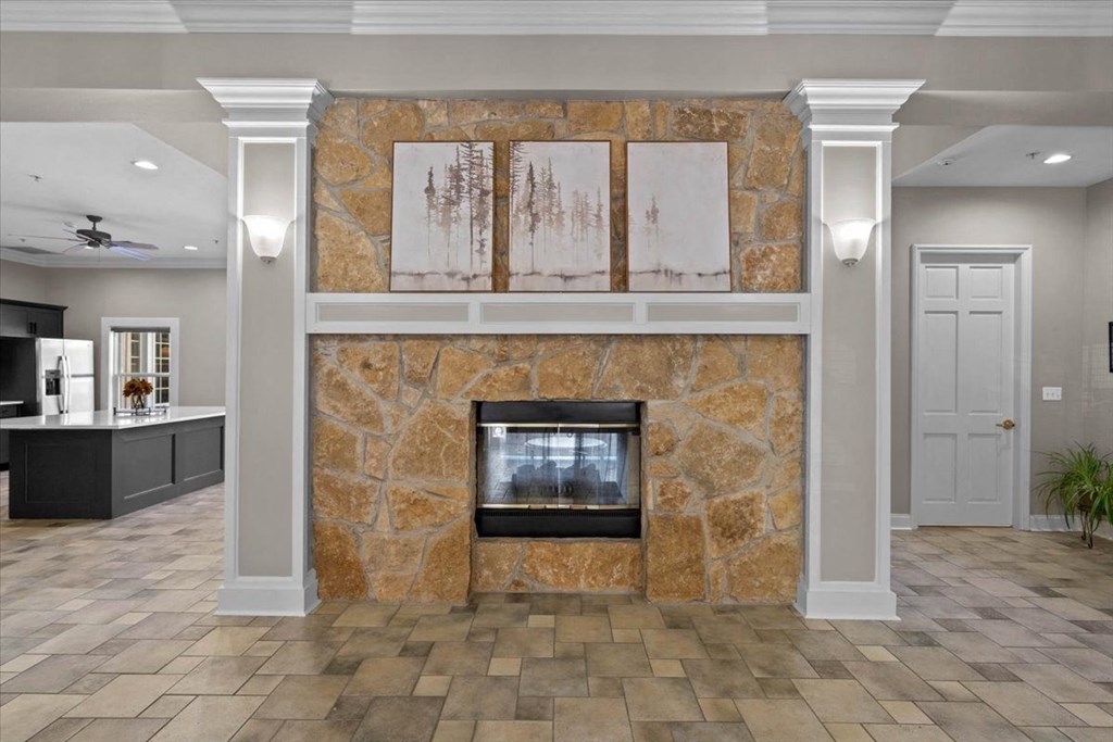 a fireplace in the center of a living room