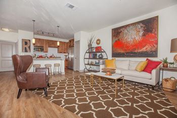 living area with couch, chairs, window at Ovation at Lewisville Apartments, Lewisville, TX
