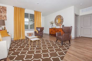 living area with couch, chairs, window at Ovation at Lewisville Apartments, Texas , 75067