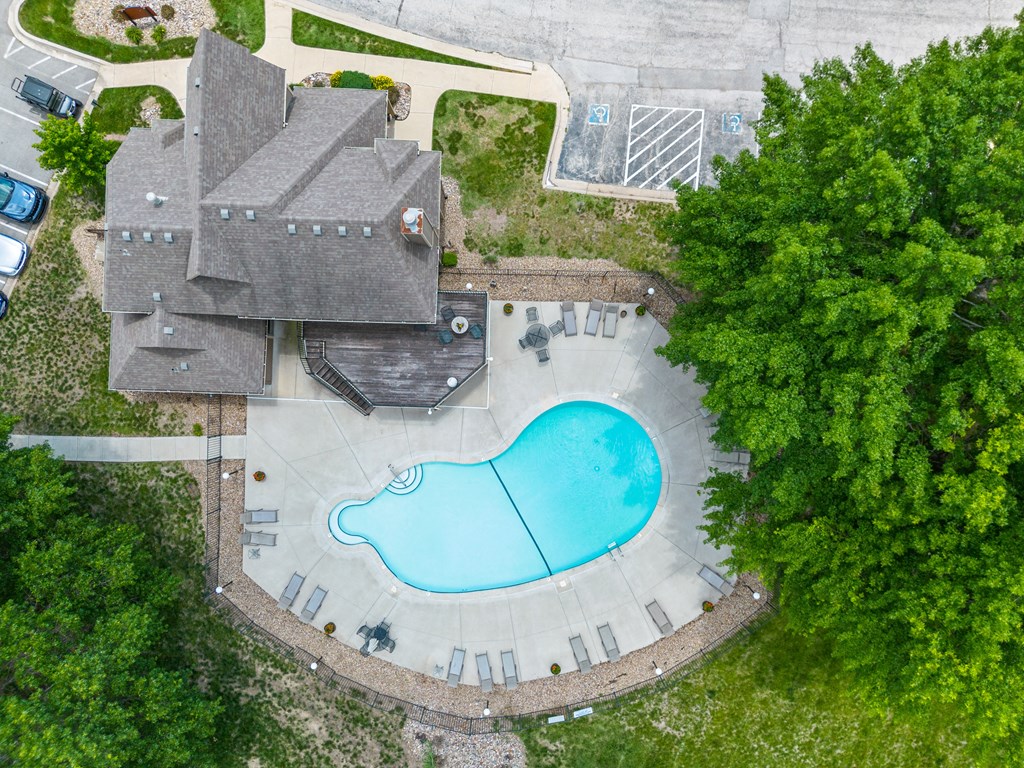 an aerial view of a house with a swimming pool at Waterford Place Apartments & Townhomes, Overland Park, Kansas