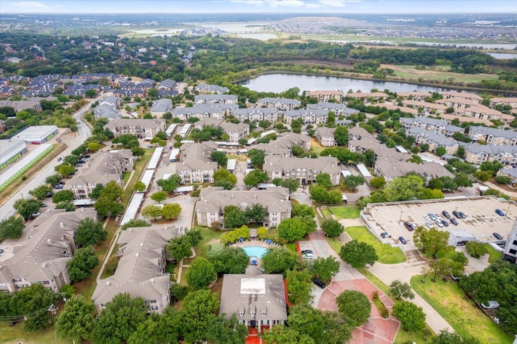 an aerial view of a neighborhood with houses at The Clairborne Apartment Homes, Grand Prairie, Texas
