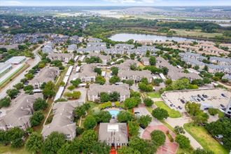an aerial view of a neighborhood with houses and trees - Photo Gallery 5