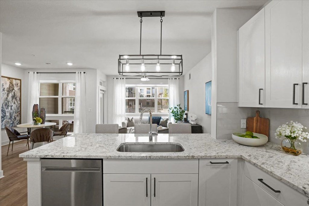a kitchen with a counter top and a sink