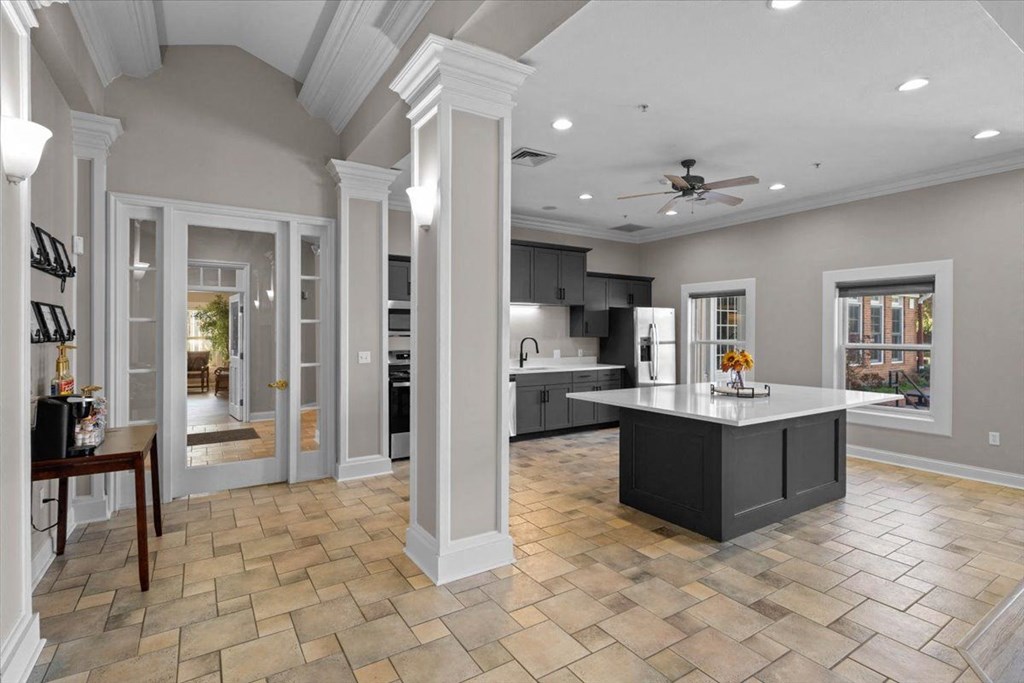 a large kitchen with an island in the middle at Somerset Oaks Apartment Homes, Kansas, 66062