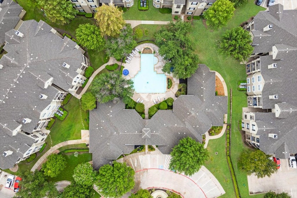 a birdseye view of a backyard with a swimming pool
