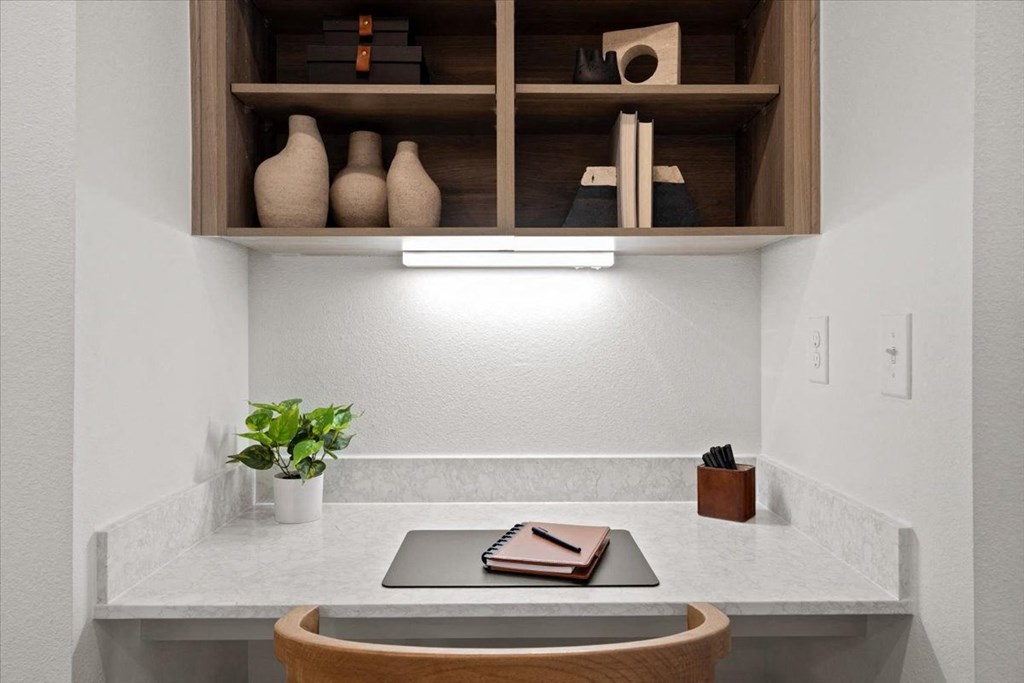 Home office with a desk and a plant