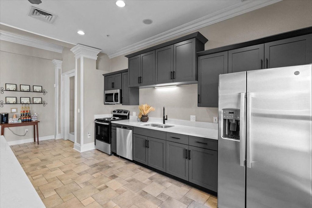 A modern kitchen with a refrigerator on the right. at Somerset Oaks Apartment Homes, Olathe, Kansas