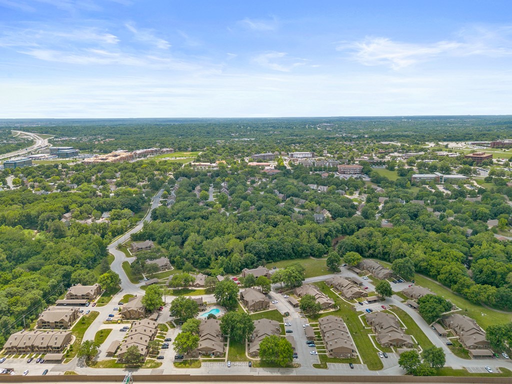 an aerial view of a neighborhood with houses and trees at Waterford Place Apartments & Townhomes, Overland Park, KS