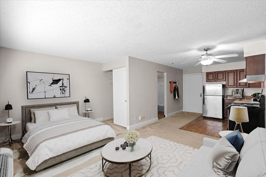 Studio floor plan near KU Med in Westport Kansas City a bedroom with a bed and a living room
