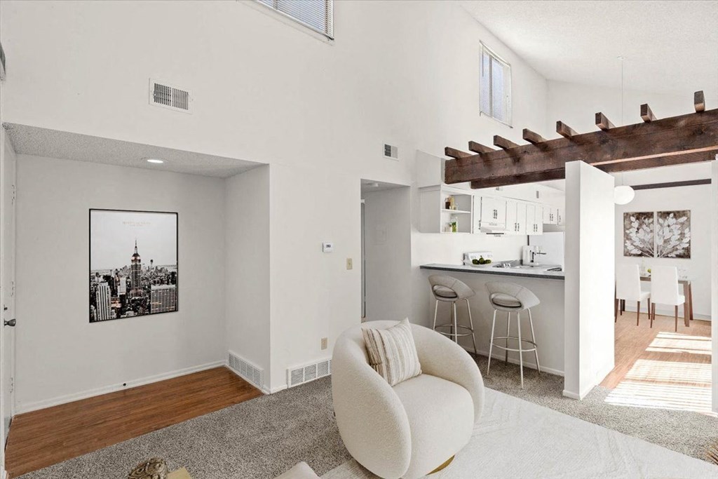 Living room with comfortable chair at Bremerton Park Apartment Homes , Kansas, 66204