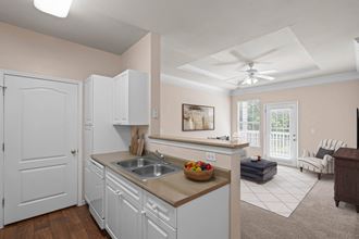 a kitchen and living room in a 555 waverly unit at Creekside, Overland Park, 66213