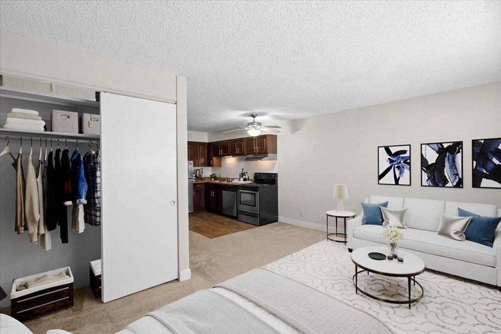 a living room and kitchen with a closet at Malvern Hill Apartment Homes, 66103