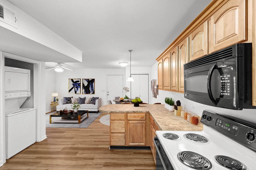 a kitchen and living room at Malvern Hill Apartment Homes, 66103, KS