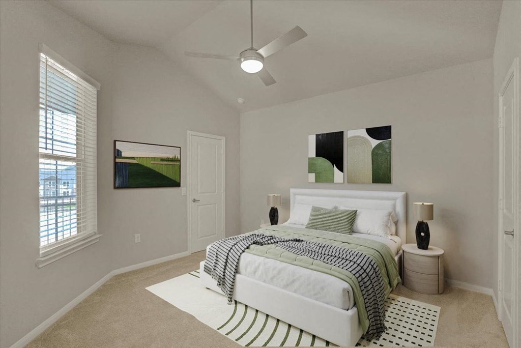 a bedroom with a bed and a ceiling fan