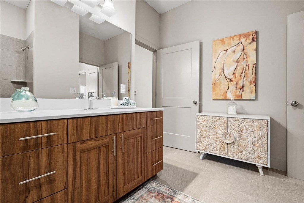 a bathroom with a sink and a mirror