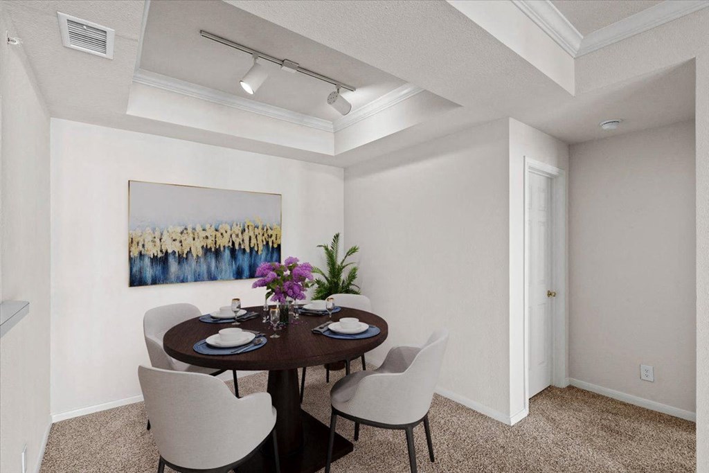 a dining room with a table and chairs  at Crescent, Lenexa, KS, 66219