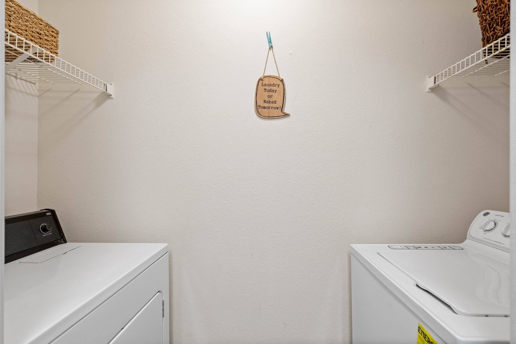 a washer and dryer in a laundry roomat Stonebriar Woods Apartments, Kansas