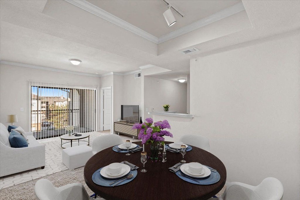 a dining room and living room with a table and chairs  at Crescent, Kansas, 66219