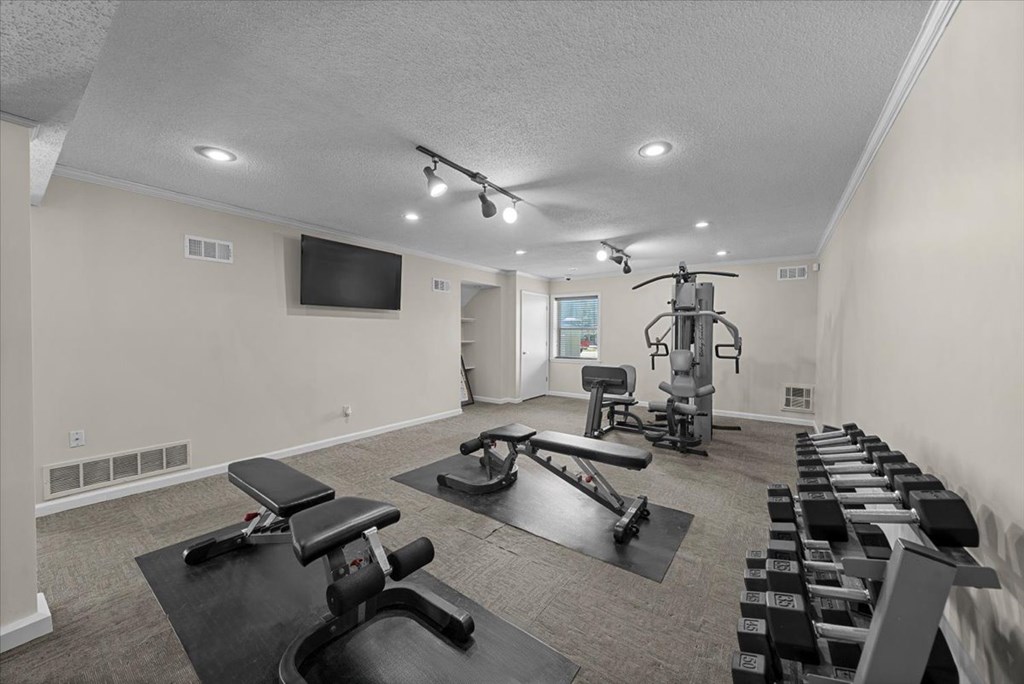 Well equipped fitness center at Louisburg Square Apartments & Townhomes, Overland Park, Kansas