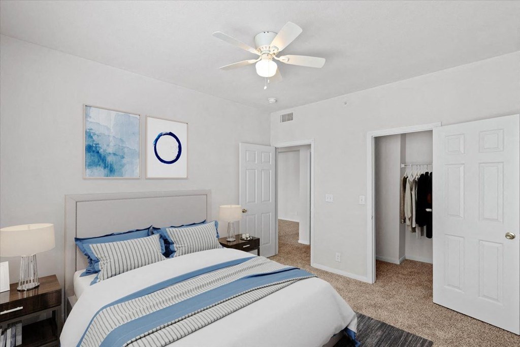 a bedroom with a bed and a ceiling fan  at Crescent, Kansas