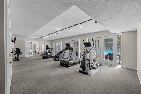 A spacious gym with a variety of exercise equipment.