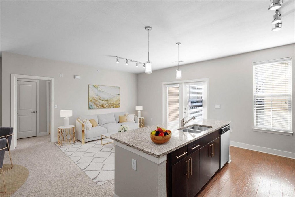 a kitchen and living room with a counter top