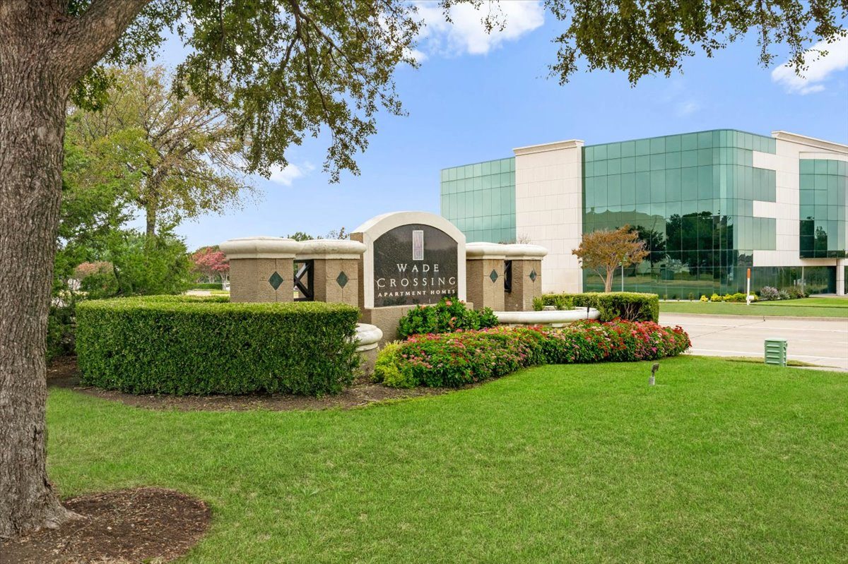 a large building with a grassy area in front of it