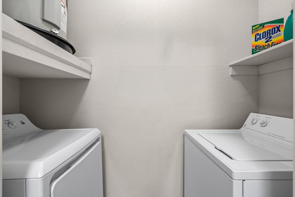 a laundry room with a washer and dryer