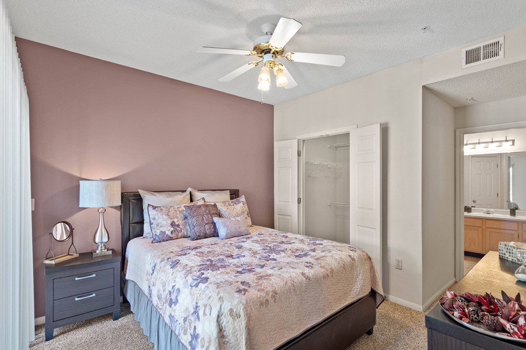 a bedroom with a bed and a ceiling fan  at Claremont, Kansas
